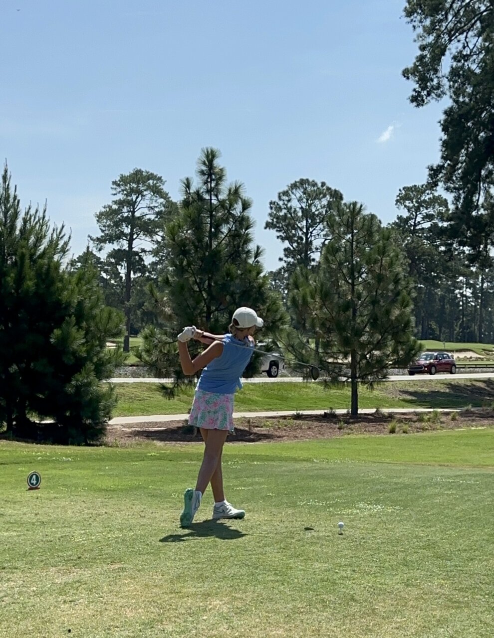 Williams student Elle Reid swings her club during a golf game