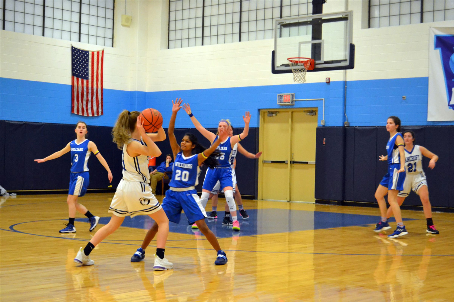 girls basketball game with Williams player defending