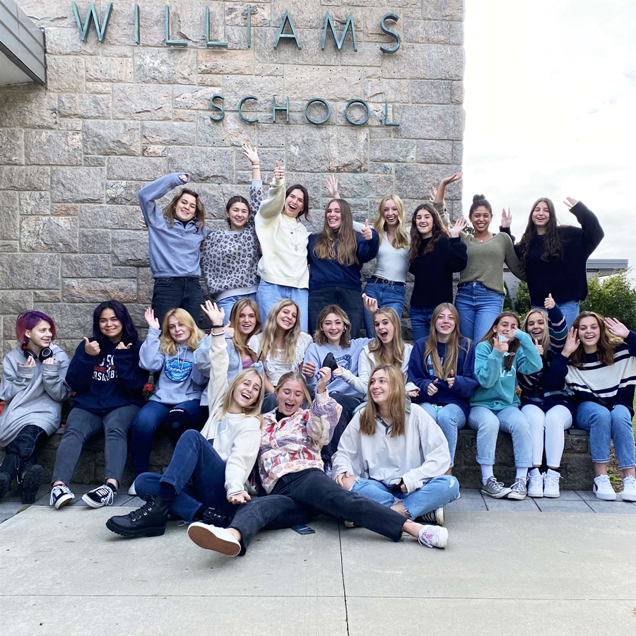 girls soccer team posing in front of the williams school
