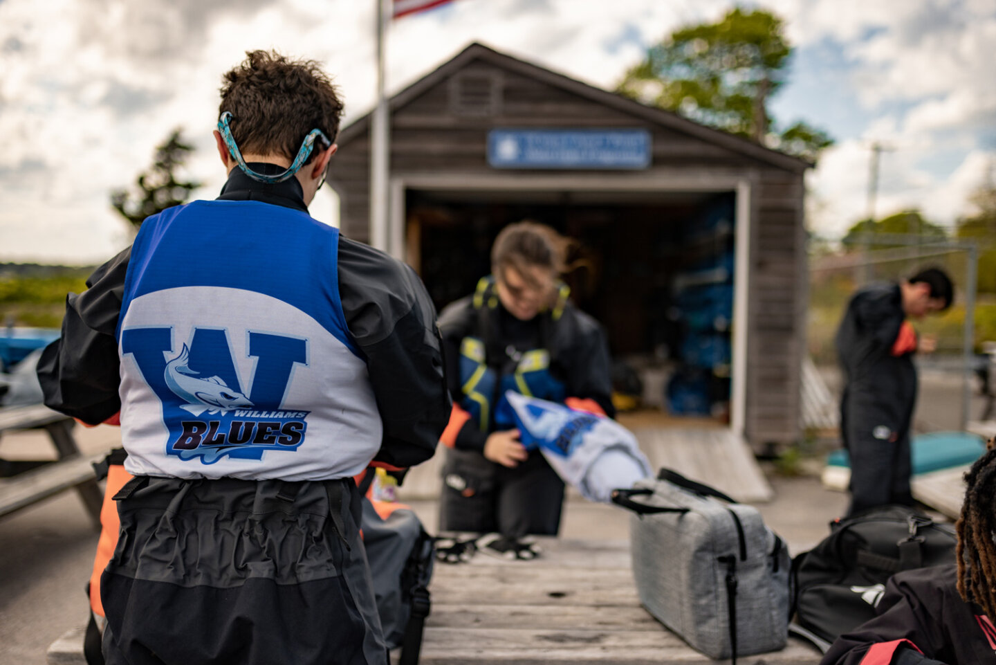 Williams sailing students put their water gear on at the marina